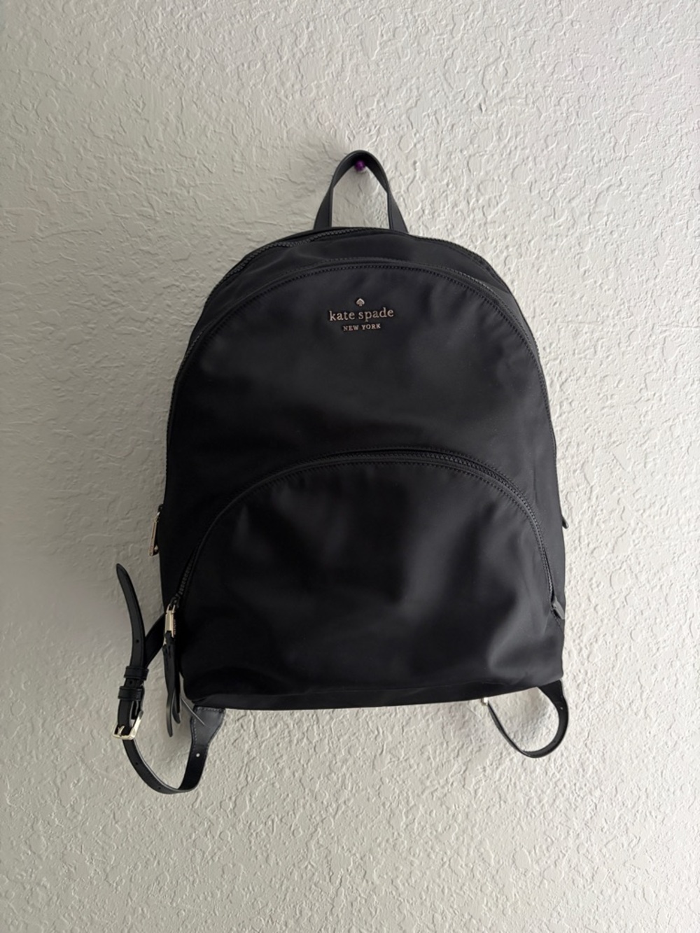 kate spade black nylon backpack with front zip pocket and logo